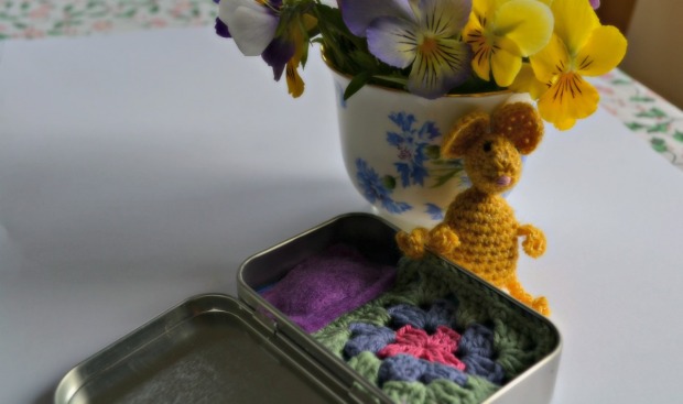 Crochet mouse in mint tin bed
